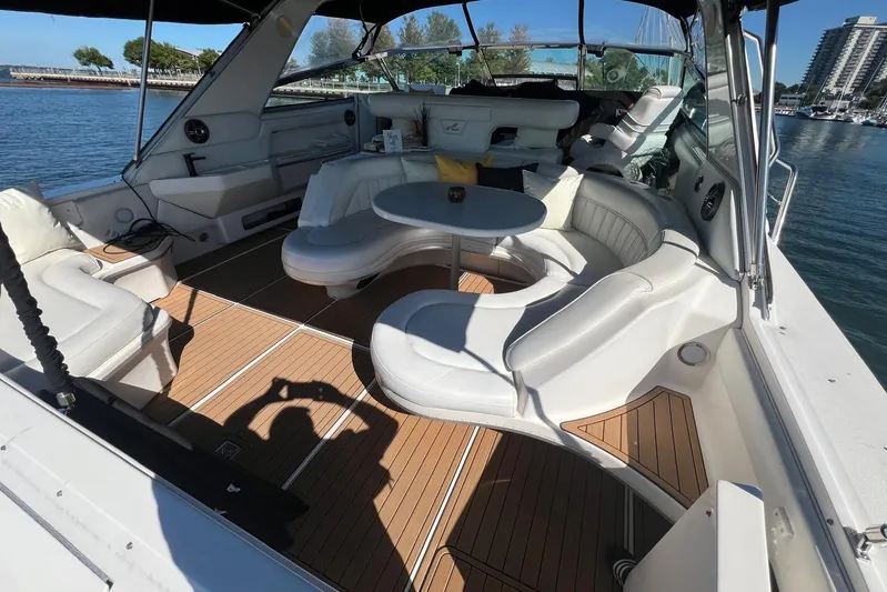 Abeona Yacht Photos Pics Luxurious 1997 Sea Ray 500 Sundancer yacht interior with elegant seating and scenic marina view.