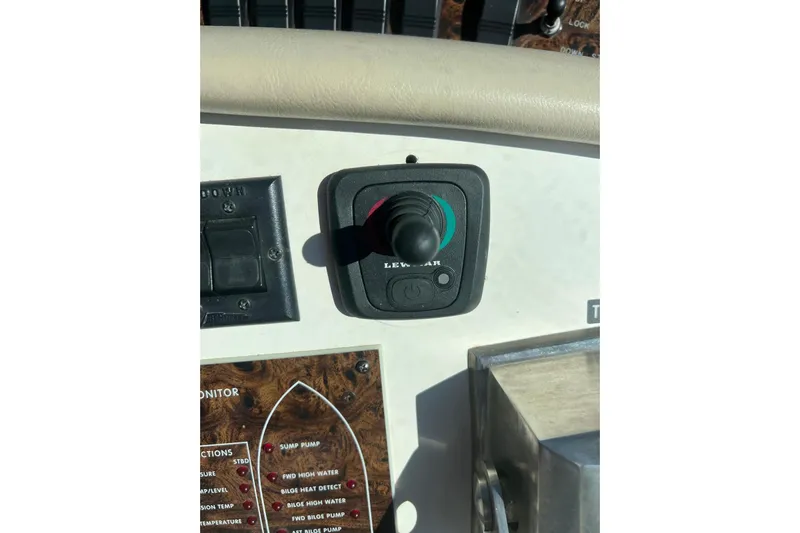 Abeona Yacht Photos Pics Control panel of a 1997 Sea Ray 500 Sundancer boat with joystick and switches.
