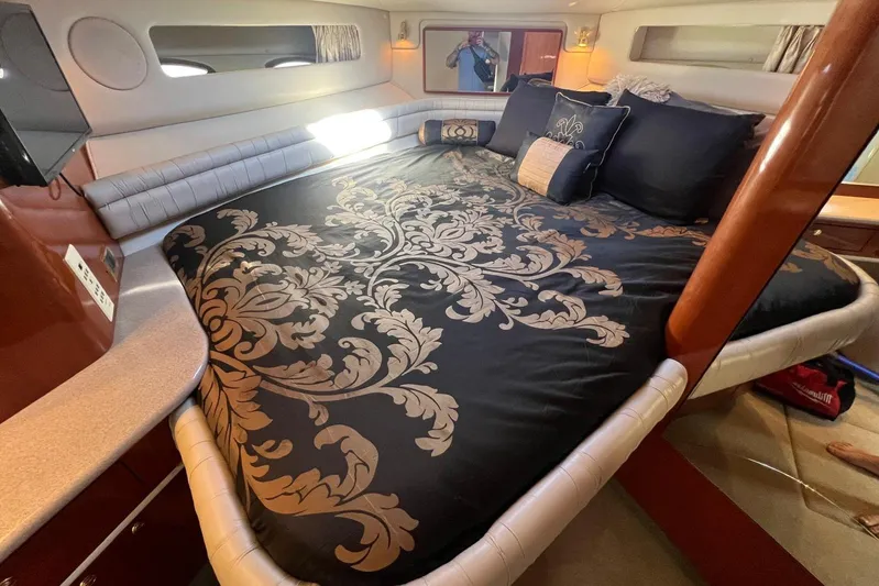 Abeona Yacht Photos Pics Luxurious bedroom interior of 1997 Sea Ray 500 Sundancer yacht with elegant bedding.