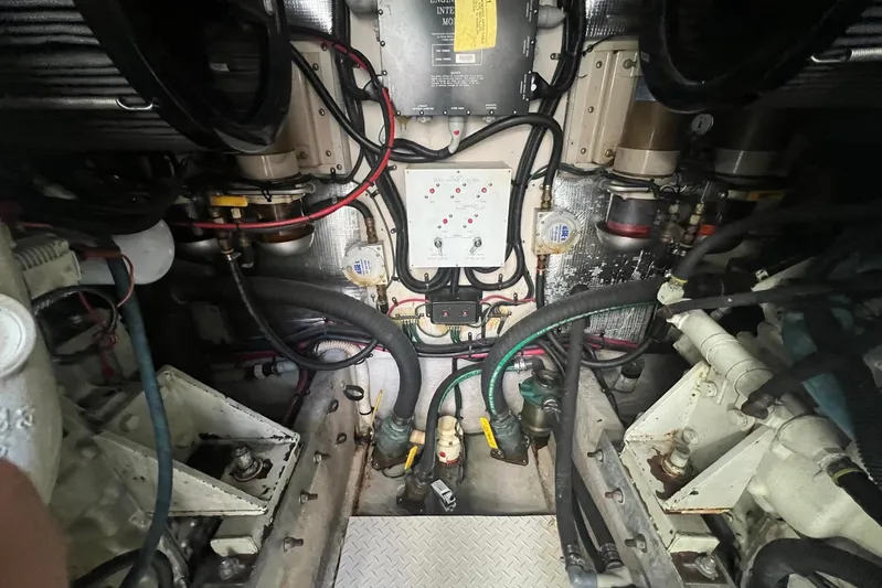 Abeona Yacht Photos Pics Engine room of a 1997 Sea Ray 500 Sundancer with visible wiring and components.