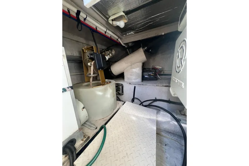 Abeona Yacht Photos Pics Engine room of a 1997 Sea Ray 500 Sundancer with mechanical components visible.