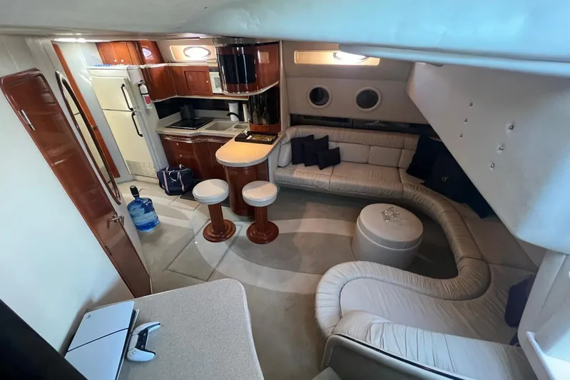 Abeona Yacht Photos Pics Luxurious interior of 1997 Sea Ray 500 Sundancer yacht with modern kitchen and seating area.