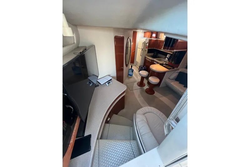 Abeona Yacht Photos Pics Interior of 1997 Sea Ray 500 Sundancer yacht with modern kitchen and seating area.