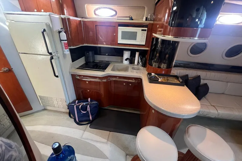 Abeona Yacht Photos Pics Luxurious 1997 Sea Ray 500 Sundancer yacht interior with kitchen and seating area.