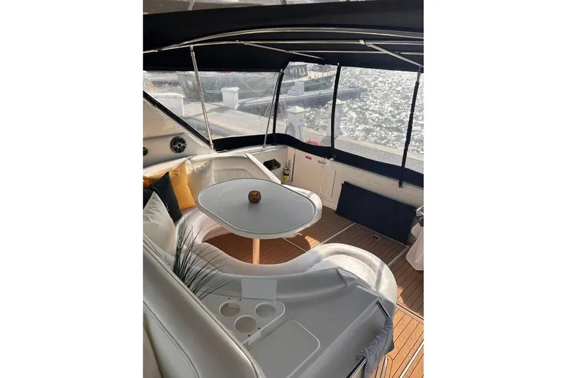 Abeona Yacht Photos Pics Luxurious 1997 Sea Ray 500 Sundancer yacht interior with elegant seating and table.