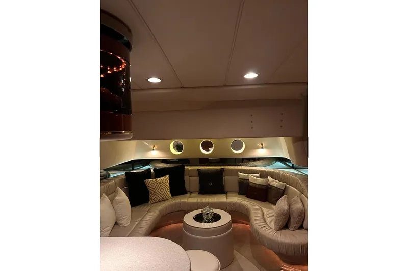 Abeona Yacht Photos Pics Luxurious interior of 1997 Sea Ray 500 Sundancer yacht with plush seating and ambient lighting.