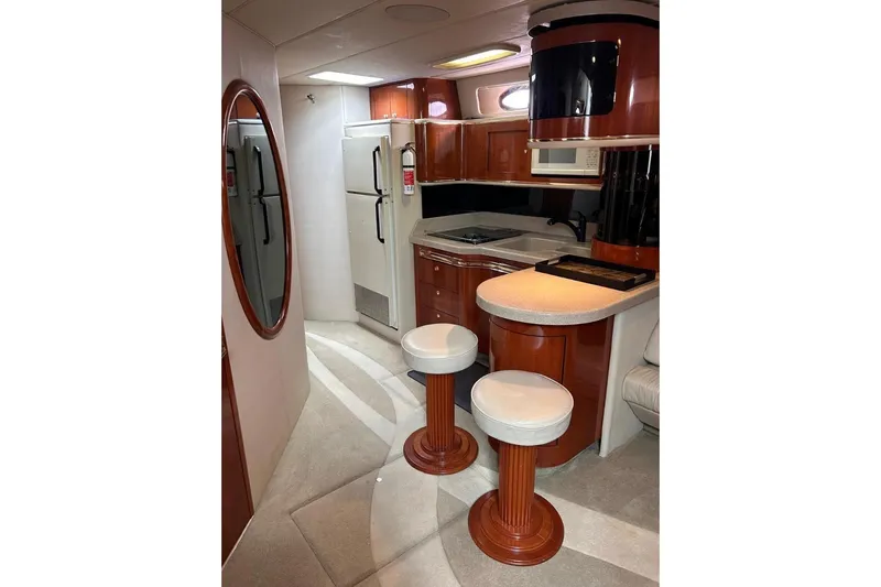 Abeona Yacht Photos Pics Luxurious 1997 Sea Ray 500 Sundancer yacht interior with modern kitchen and seating area.