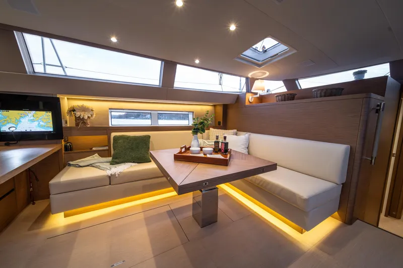 Fortitude Yacht Photos Pics Luxurious CNB 66 yacht interior, 2021 model, featuring elegant seating and ambient lighting.