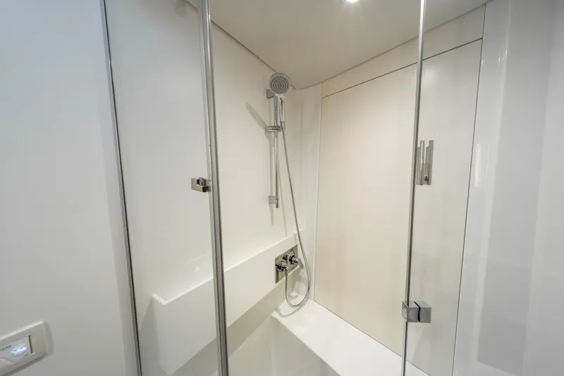 Fortitude Yacht Photos Pics Modern shower cabin in CNB 66 yacht, 2021 model, with sleek glass doors.