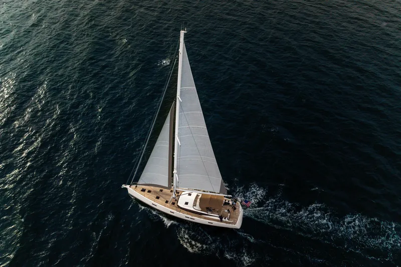 Fortitude Yacht Photos Pics Aerial view of 2021 CNB 66 sailboat navigating open sea waters.