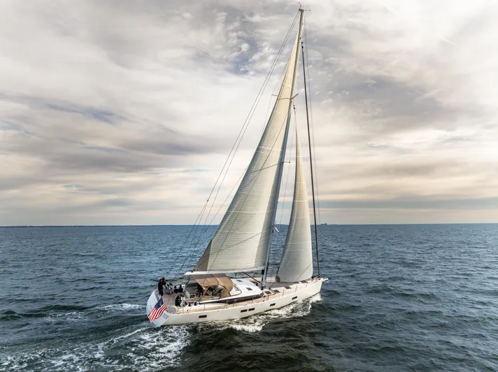 Fortitude Yacht Photos Pics Sailing yacht CNB 66, 2021 model, cruising on open sea under cloudy skies.