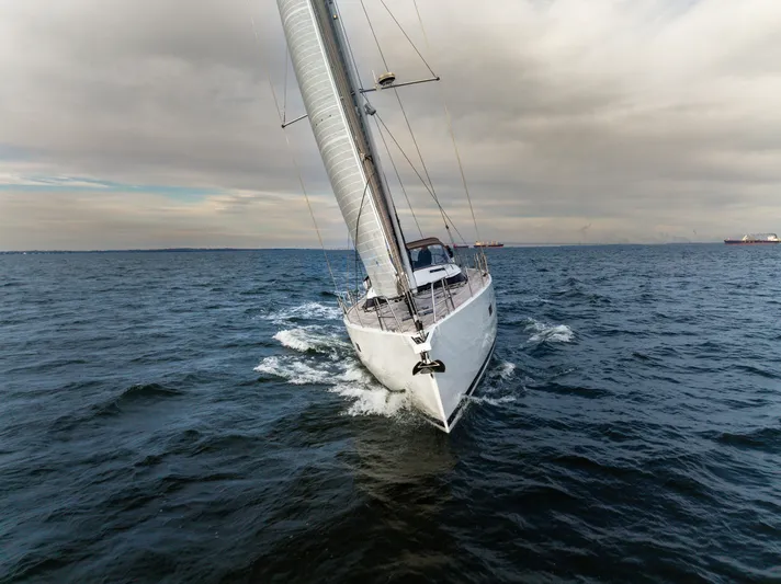 Fortitude Yacht Photos Pics Sailing yacht CNB 66 (2021) navigating open sea under cloudy skies.