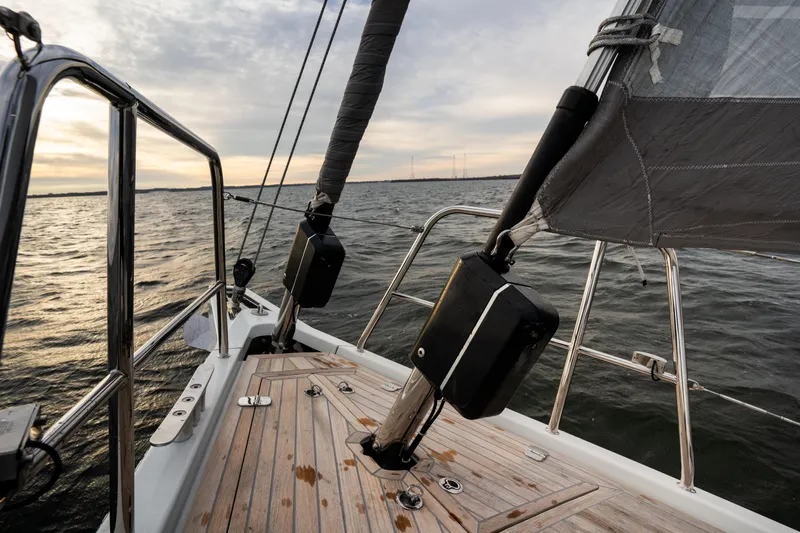 Fortitude Yacht Photos Pics Sailing yacht CNB 66, 2021 model, on open water at sunset.