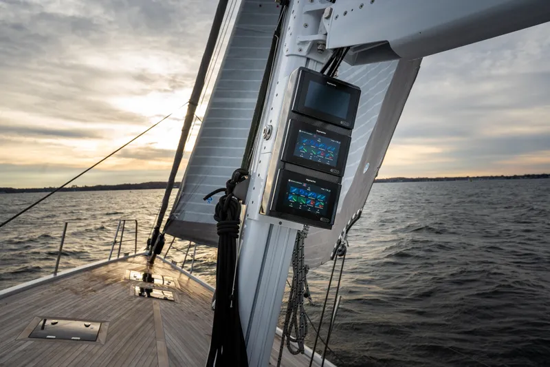 Fortitude Yacht Photos Pics Sailing yacht CNB 66, 2021 model, with advanced navigation displays at sunset.