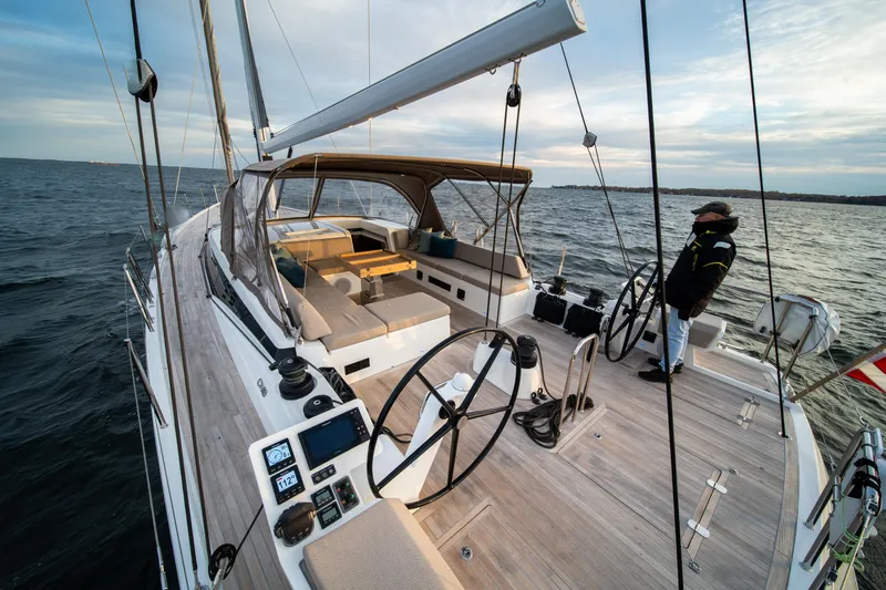 Fortitude Yacht Photos Pics Luxurious 2021 CNB 66 yacht sailing on open water, featuring spacious deck and modern design.
