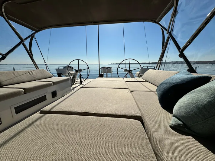 Fortitude Yacht Photos Pics Luxurious 2021 CNB 66 yacht interior with spacious seating and ocean view.