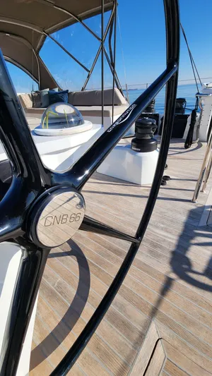 Fortitude Yacht Photos Pics Steering wheel of a 2021 CNB 66 yacht on a sunny day.