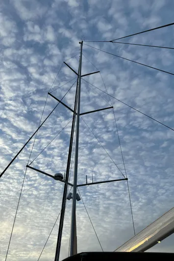 Fortitude Yacht Photos Pics Sailboat mast against a cloudy sky, CNB 66, 2021 model.