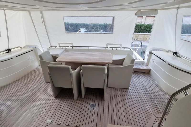 M/y "catherine" Yacht Photos Pics Spacious deck area of 2002 Ferretti Yachts 680 with elegant seating and table.