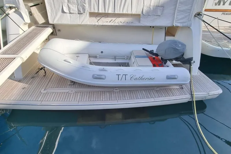 M/y "catherine" Yacht Photos Pics Inflatable dinghy on Ferretti Yachts 680, 2002 model, docked at marina.