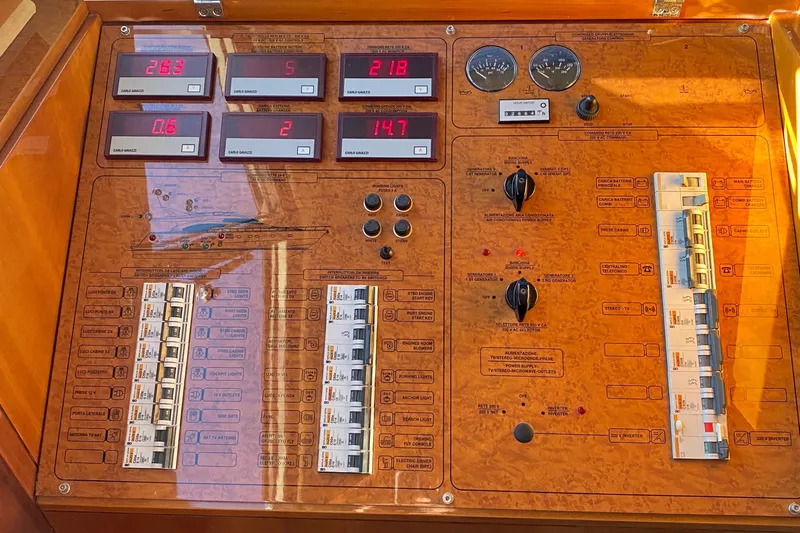 M/y "catherine" Yacht Photos Pics Control panel of a 2002 Ferretti Yachts 680, featuring gauges and switches.