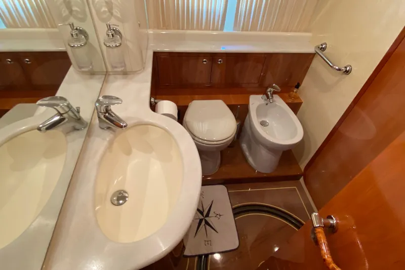 M/y "catherine" Yacht Photos Pics Luxurious bathroom in 2002 Ferretti Yachts 680, featuring sink, toilet, and bidet.