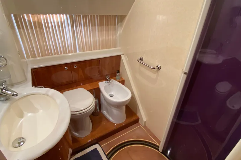 M/y "catherine" Yacht Photos Pics Luxurious bathroom in 2002 Ferretti Yachts 680, featuring sink, toilet, and bidet.