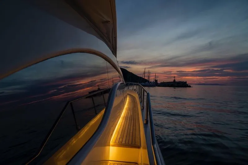 M/y "catherine" Yacht Photos Pics Sunset view from 2002 Ferretti Yachts 680, reflecting on calm waters.