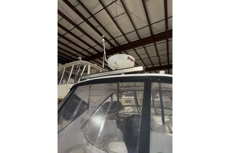 Easy Roller Yacht Photos Pics 2009 Regal Commodore 3760 IO boat in storage, featuring radar equipment.