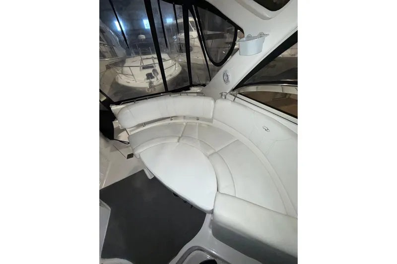 Easy Roller Yacht Photos Pics 2009 Regal Commodore 3760 IO interior with curved white seating and windows.