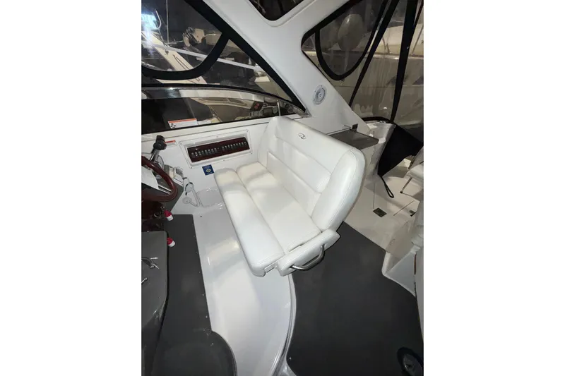 Easy Roller Yacht Photos Pics 2009 Regal Commodore 3760 IO interior with white seating and control panel.