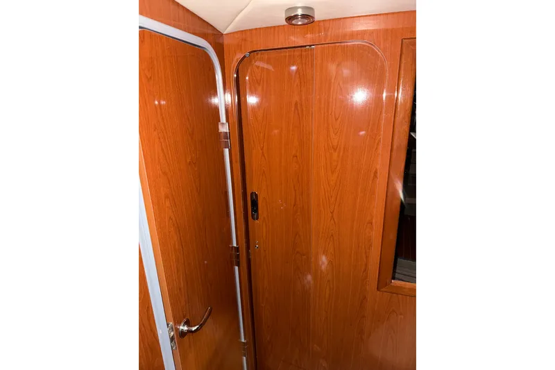 Easy Roller Yacht Photos Pics 2009 Regal Commodore 3760 IO interior with wooden door and paneling.