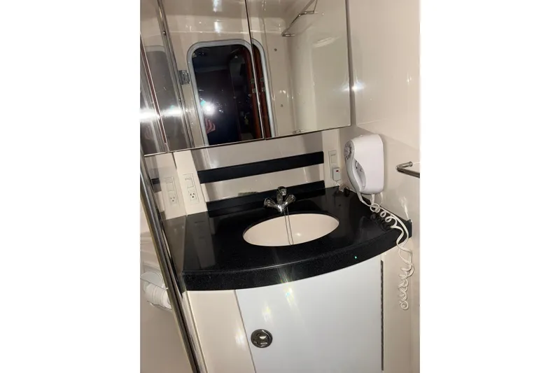 Easy Roller Yacht Photos Pics 2009 Regal Commodore 3760 IO bathroom with sleek sink and modern fixtures.