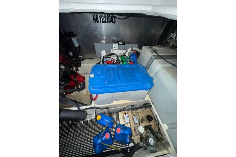 Easy Roller Yacht Photos Pics Engine compartment of 2009 Regal Commodore 3760 IO with blue battery and components.