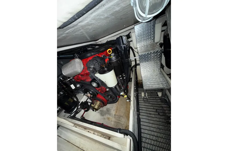 Easy Roller Yacht Photos Pics Engine compartment of 2009 Regal Commodore 3760 IO boat, featuring mechanical components and metal steps.
