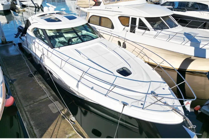  Yacht Photos Pics 2012 Sea Ray 470 Sundancer yacht docked at marina, sleek design, white exterior.