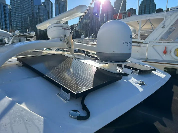  Yacht Photos Pics 2012 Sea Ray 470 Sundancer yacht with solar panels and radar, docked in a marina.