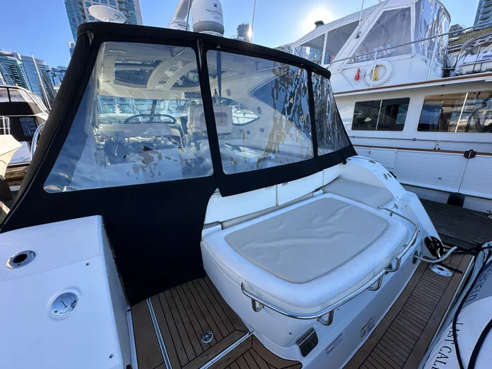  Yacht Photos Pics 2012 Sea Ray 470 Sundancer yacht with spacious seating and sleek design at a marina.