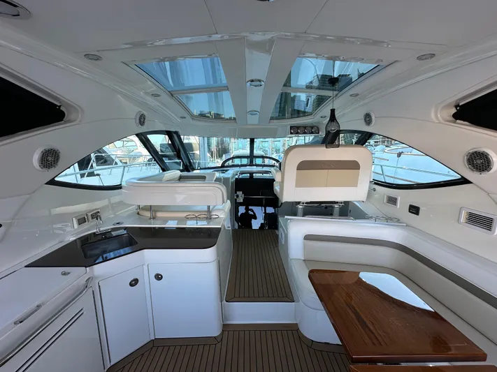  Yacht Photos Pics Interior of 2012 Sea Ray 470 Sundancer yacht with modern kitchen and seating area.