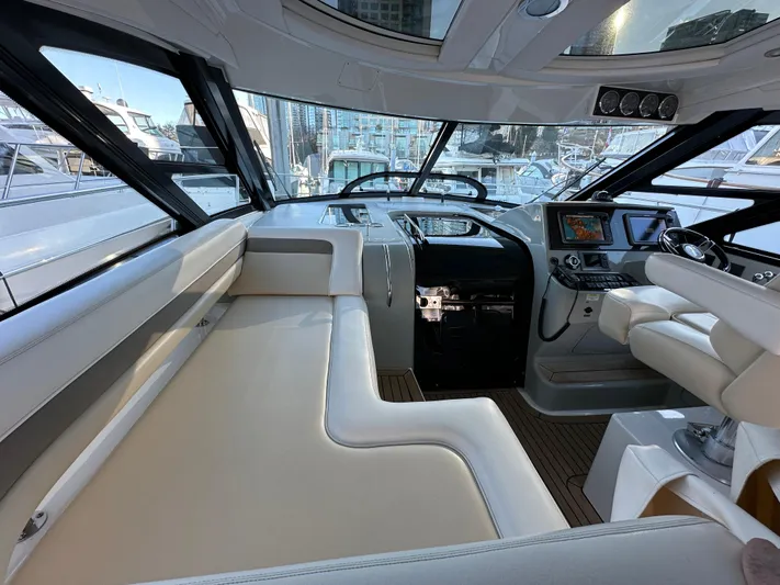 Yacht Photos Pics Luxurious interior of 2012 Sea Ray 470 Sundancer yacht with modern helm and seating.