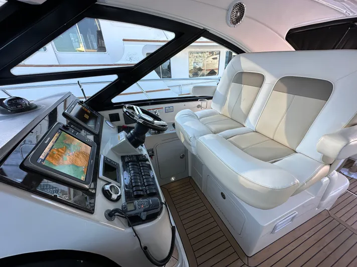  Yacht Photos Pics Interior cockpit of 2012 Sea Ray 470 Sundancer yacht with modern navigation equipment.