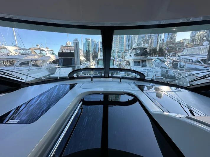  Yacht Photos Pics Interior view from a 2012 Sea Ray 470 Sundancer yacht, overlooking a marina.