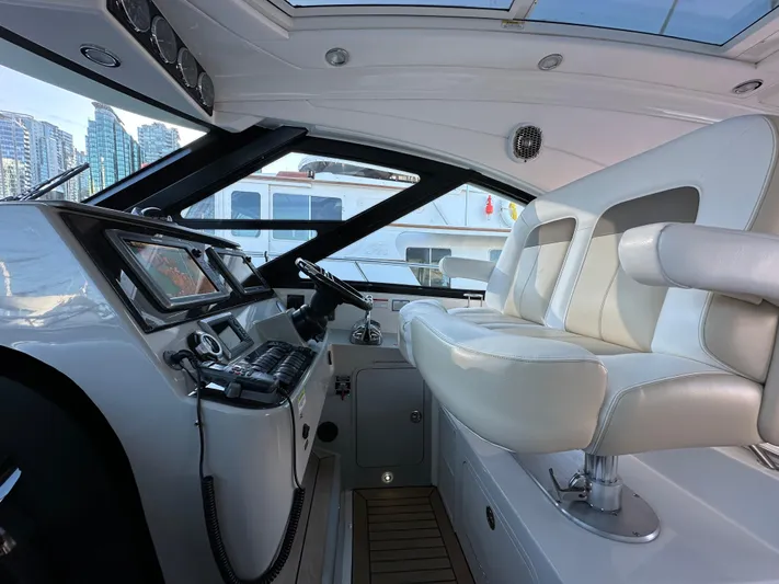  Yacht Photos Pics Luxurious 2012 Sea Ray 470 Sundancer yacht cockpit with modern controls and plush seating.