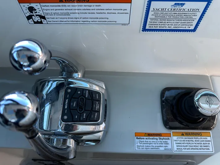  Yacht Photos Pics Control panel of 2012 Sea Ray 470 Sundancer yacht with joystick and throttle levers.