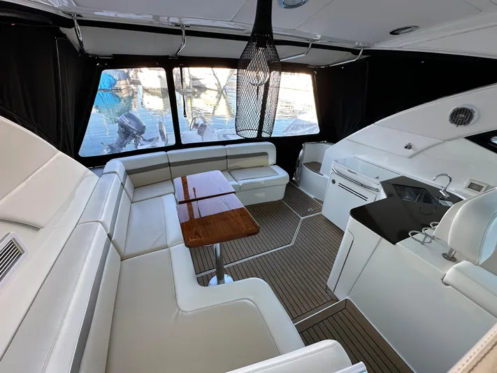  Yacht Photos Pics Luxurious interior of 2012 Sea Ray 470 Sundancer yacht with elegant seating and dining area.