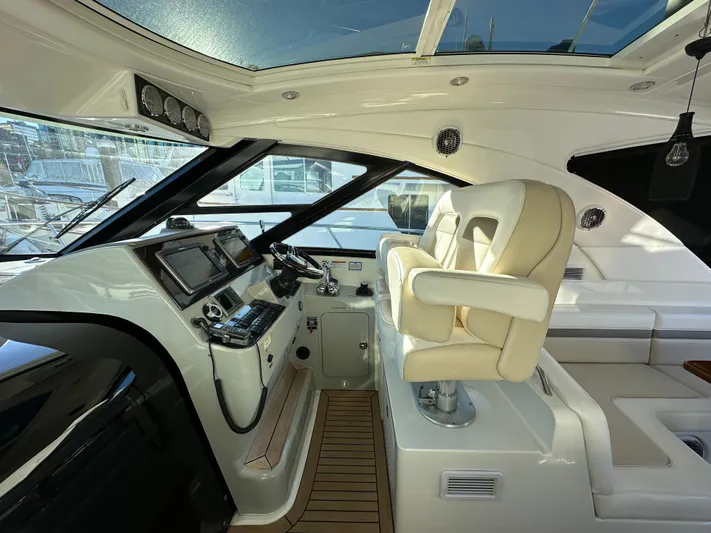  Yacht Photos Pics Interior of 2012 Sea Ray 470 Sundancer yacht with helm and captain's chair.