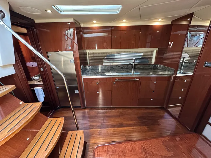  Yacht Photos Pics Luxurious interior of 2012 Sea Ray 470 Sundancer yacht with modern kitchen design.