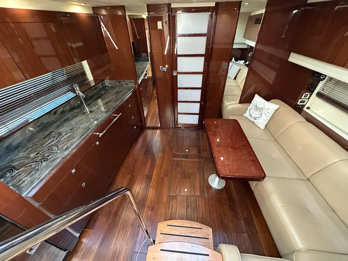  Yacht Photos Pics Luxurious interior of 2012 Sea Ray 470 Sundancer yacht with elegant wood finishes.