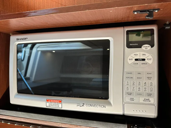 Yacht Photos Pics Sharp microwave in 2012 Sea Ray 470 Sundancer yacht kitchen.