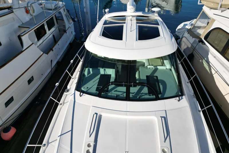  Yacht Photos Pics 2012 Sea Ray 470 Sundancer yacht docked between boats, top view.